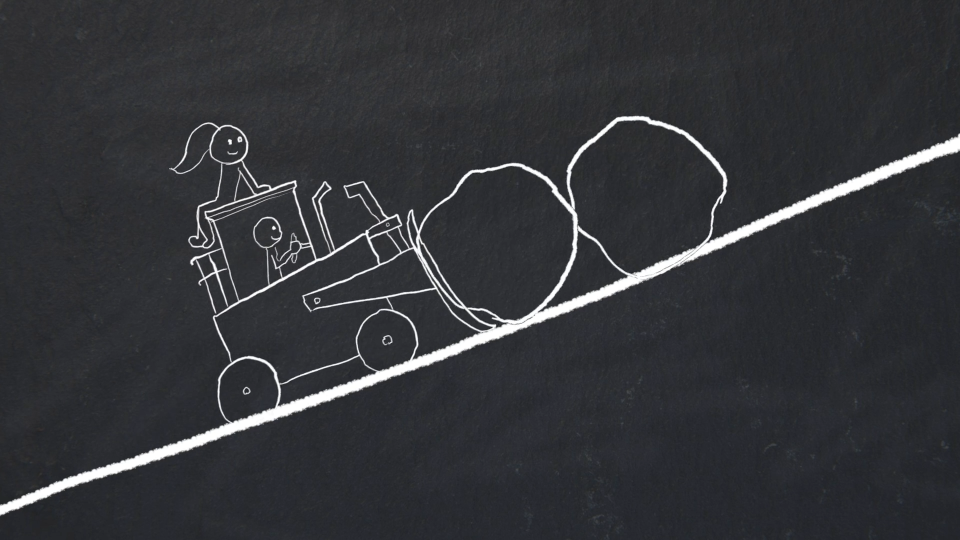 A person driving a vehicle that is pushing two boulders up a hill while another person is riding on top of the vehicle