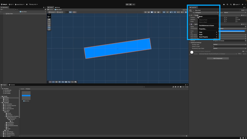 The blue gem prefab selected and a right click / context menu open on the Transform component with an option to reset it